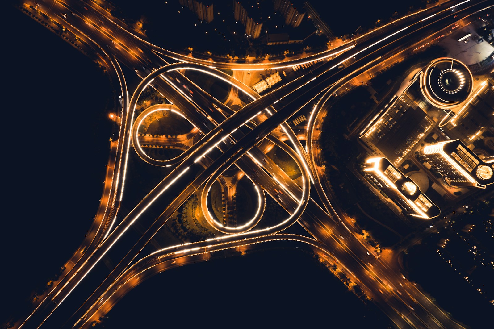 an aerial view of an intersection at night